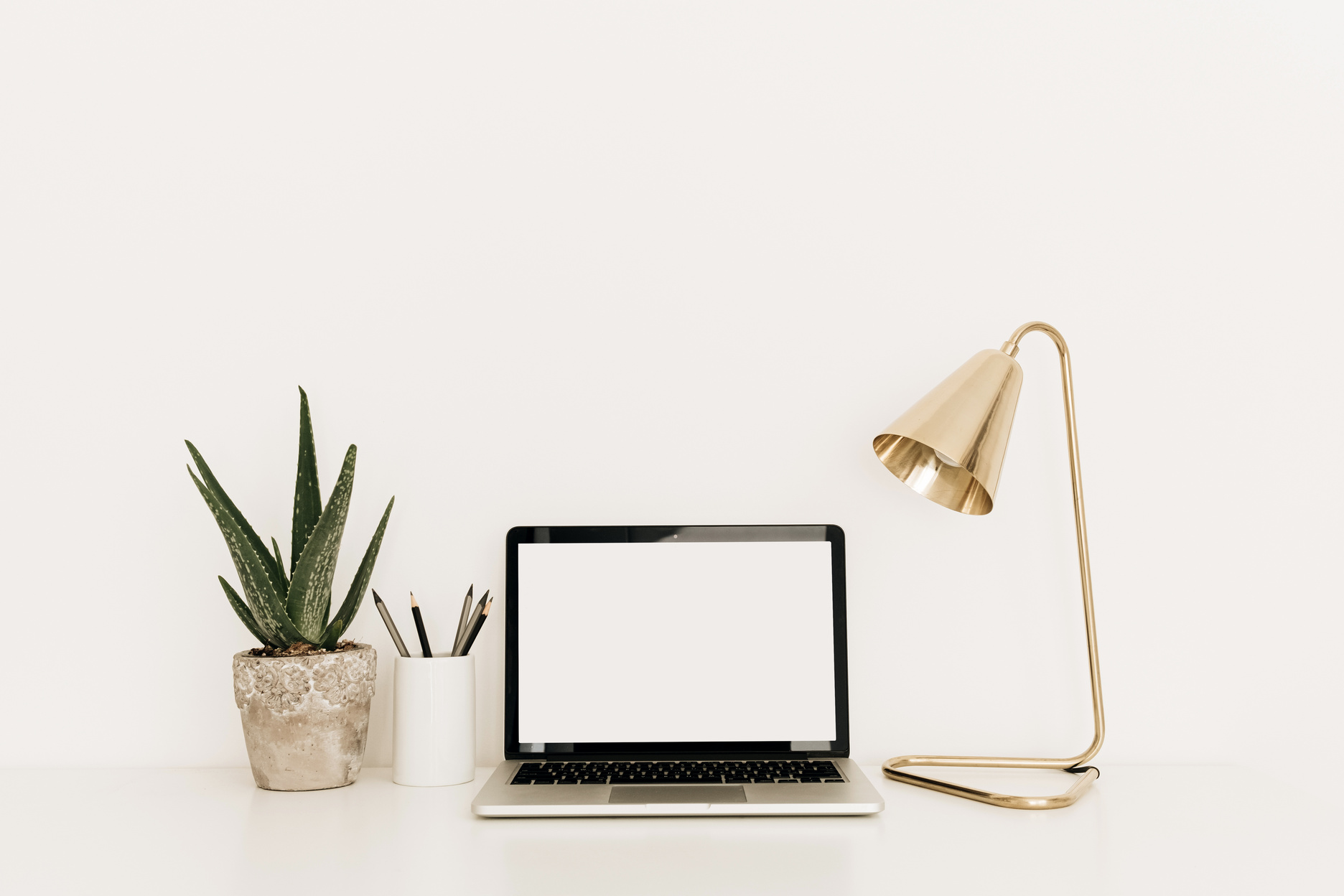 Laptop with Desk Lamp on White Desk